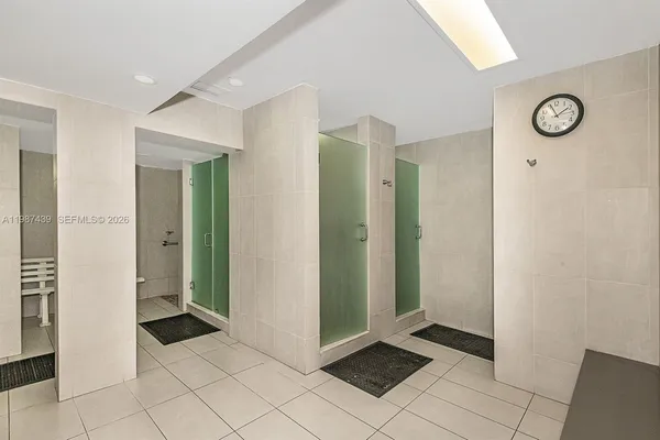 a bathroom with a shower and a sink