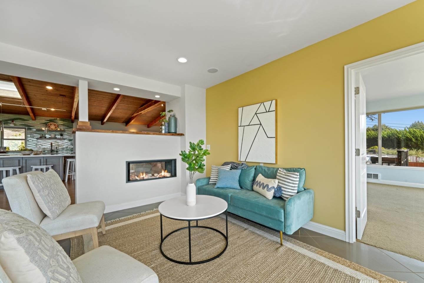 7440 Viewpoint Road Aptos, CA 95003 - Photo 14 of 39 a living room with furniture and a fireplace