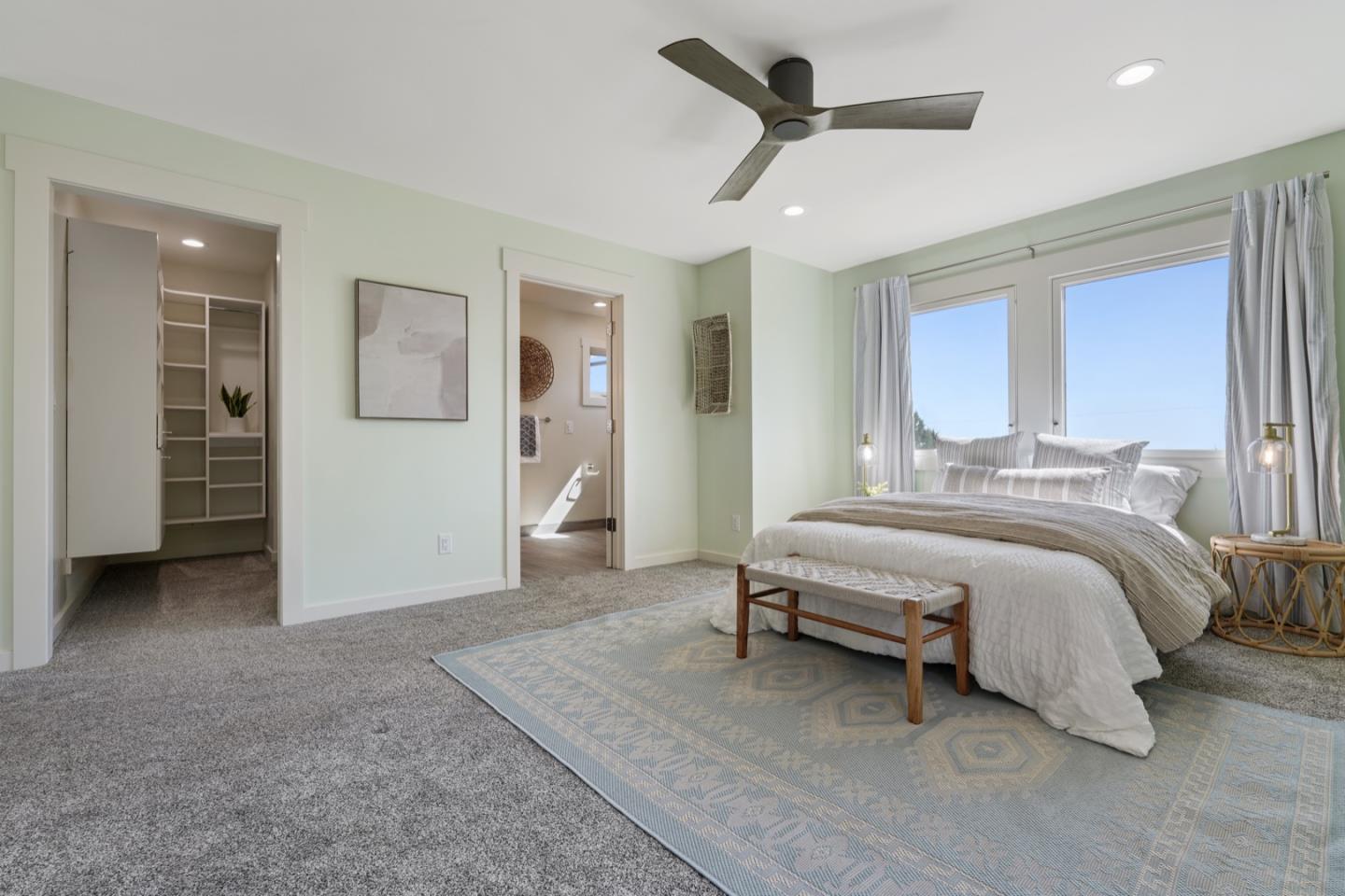 7440 Viewpoint Road Aptos, CA 95003 - Photo 27 of 39 a spacious bedroom with a bed and a chandelier