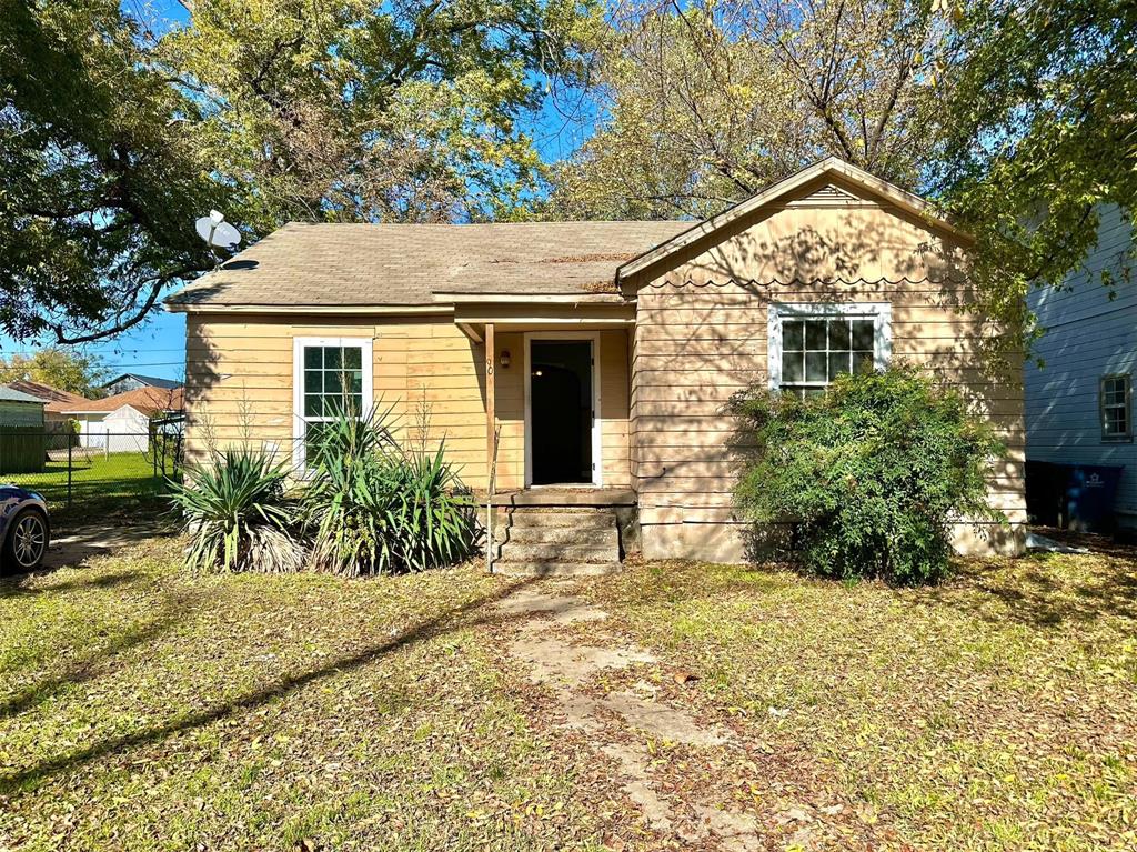609 West Owings Street Denison, TX 75020 - Photo 1 of 1 a front view of a house with a yard