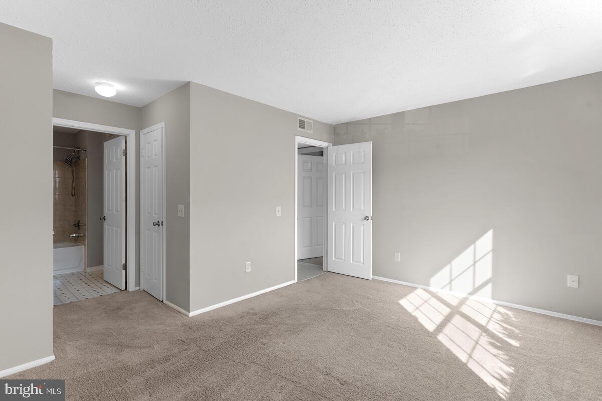 106 Fort Evans Road Southeast, Unit A Leesburg, VA 20175 - Photo 17 of 29 Primary Bedroom, Main Level