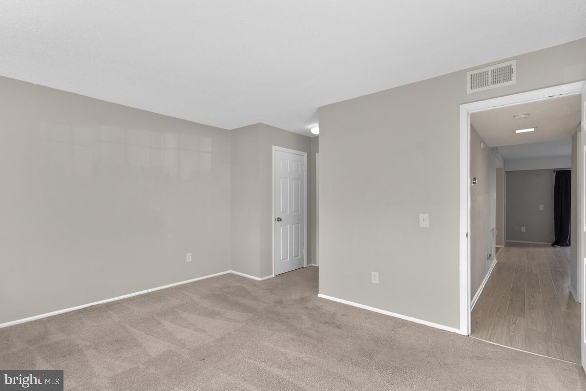 106 Fort Evans Road Southeast, Unit A Leesburg, VA 20175 - Photo 18 of 29 Primary Bedroom, Main Level