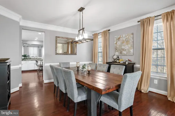 a living room with fireplace furniture and a wooden floor