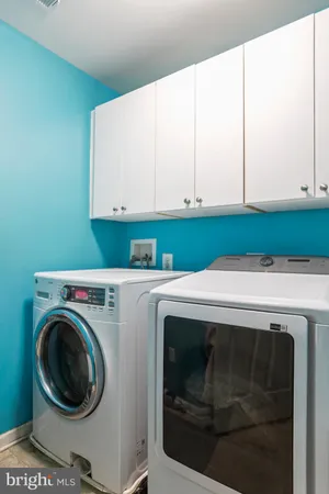 a spacious bathroom with a tub shower and sink
