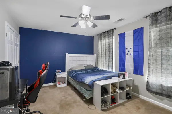 a bed room with a bed and a chandelier