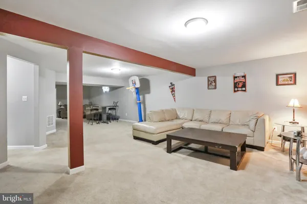 a living room with furniture and a table