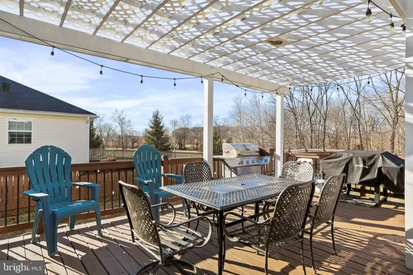 a view of a patio with a table and chairs