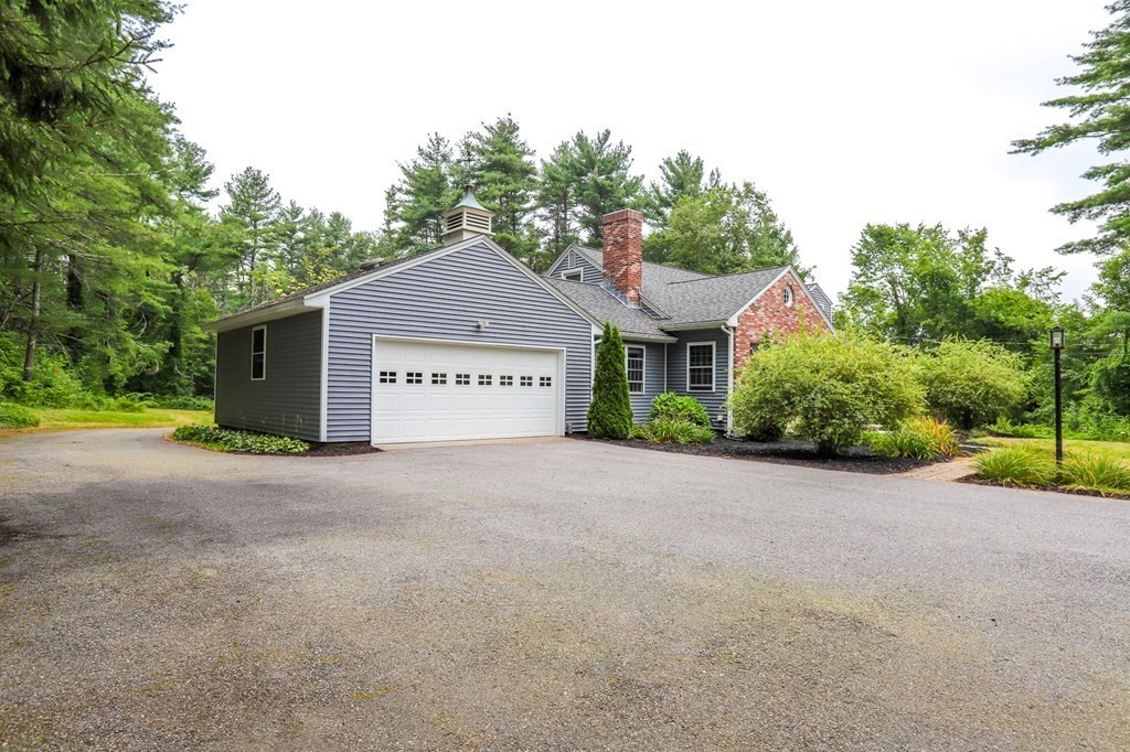 62 Parker Road Shirley, MA 01464 - Photo 4 of 42 a view of a house with a yard and garage