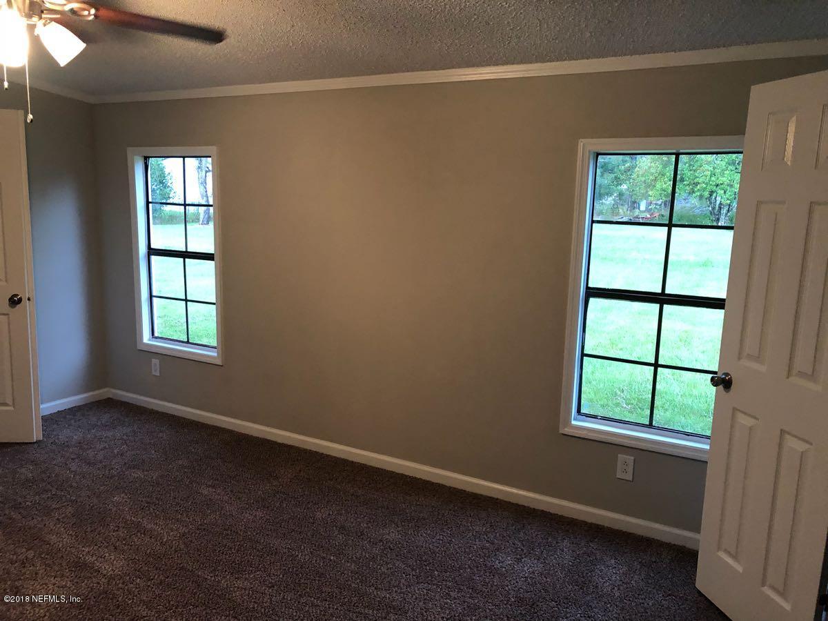 54254 Heller Road Callahan, FL 32011 - Photo 11 of 25 an empty room with windows