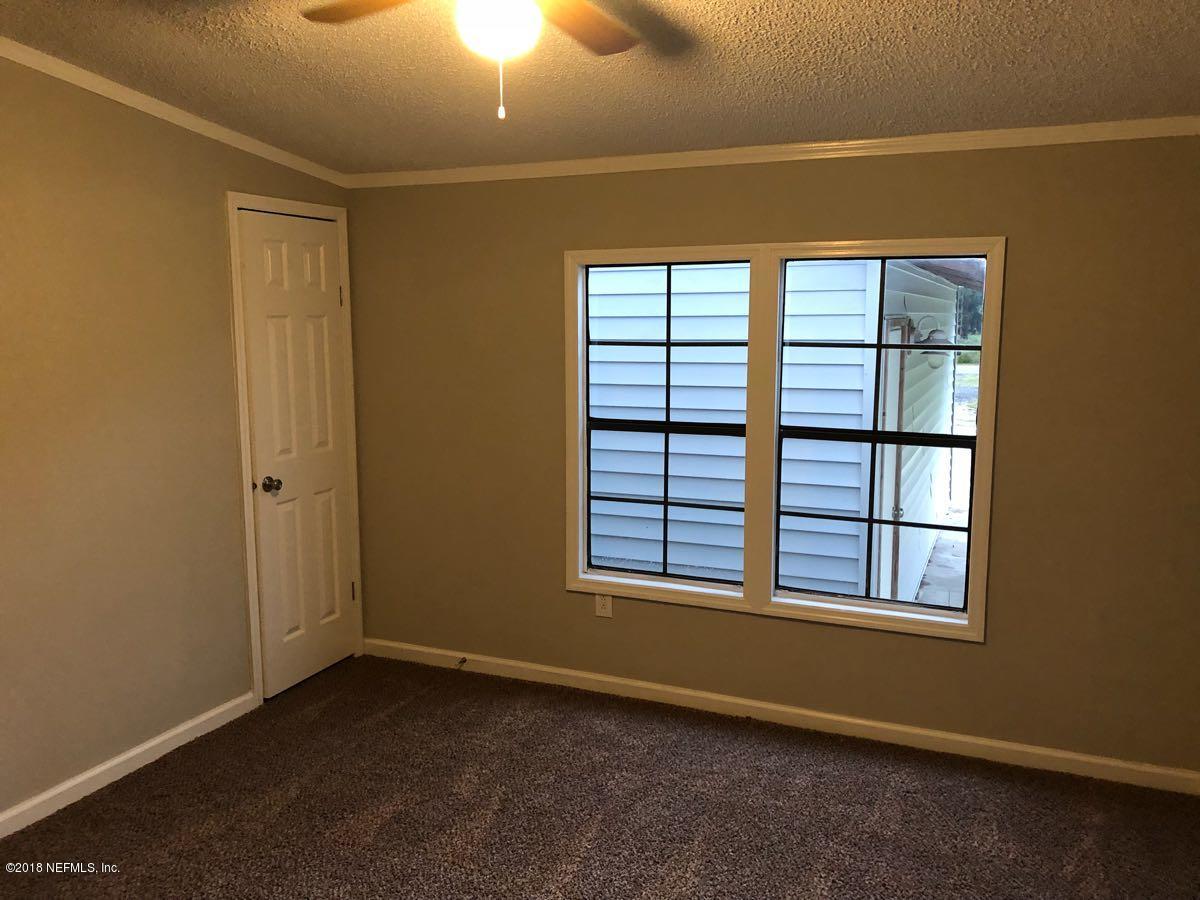 54254 Heller Road Callahan, FL 32011 - Photo 16 of 25 an empty room with windows
