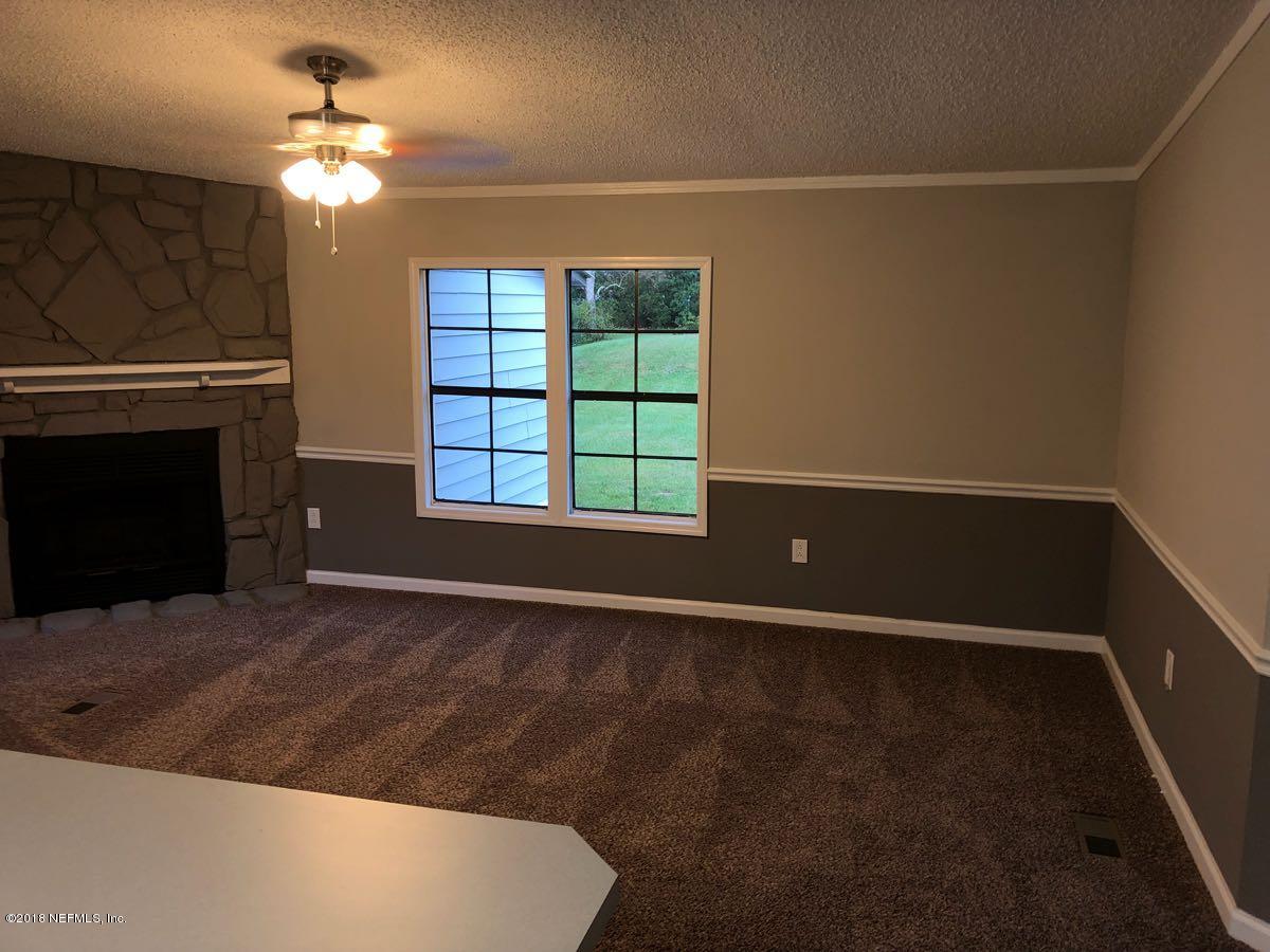 54254 Heller Road Callahan, FL 32011 - Photo 4 of 25 a view of an empty room with a window