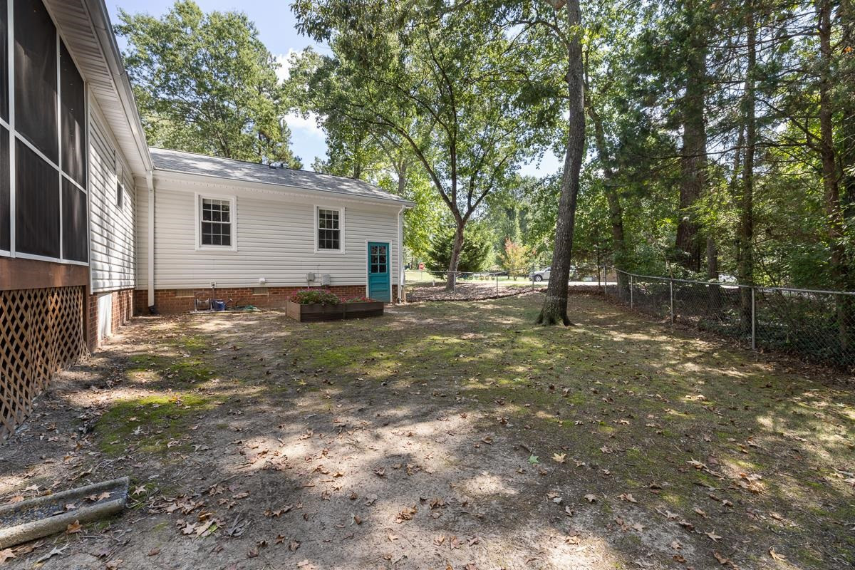 5404 McCormick Road Durham, NC 27713 - Photo 29 of 37 a view of a house with a yard