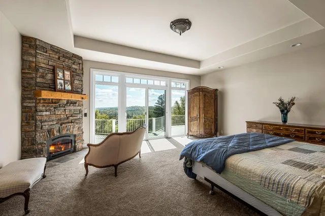 a bath tub sitting in a bathroom next to a window