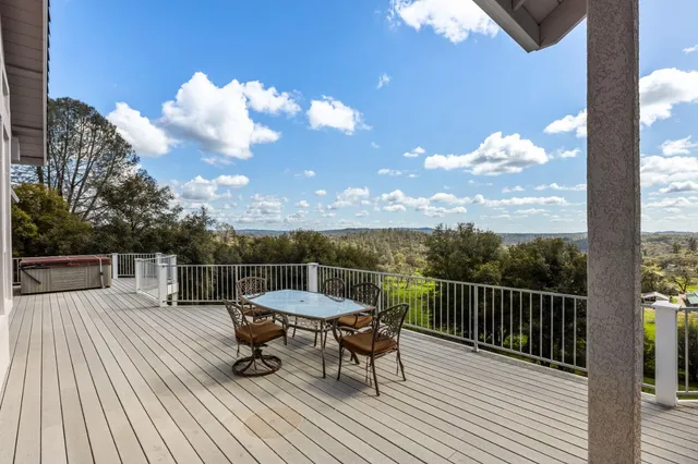 a view of a chairs and table on the terrace