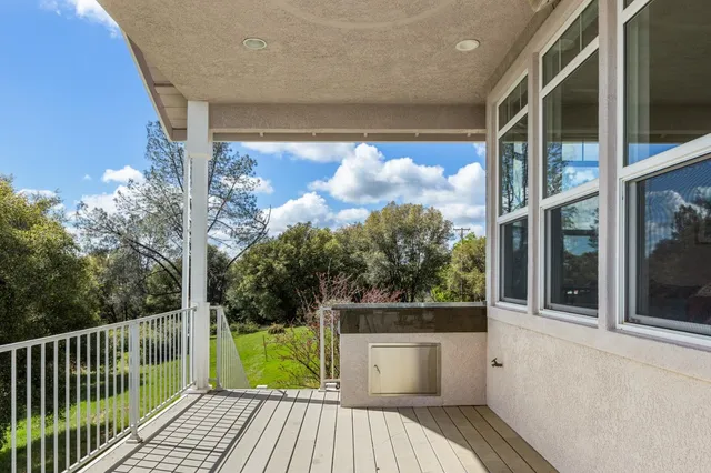 a bedroom with a large bed and a large window