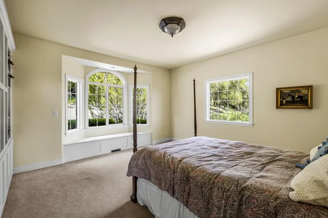 a bathroom with a sink mirror and toilet