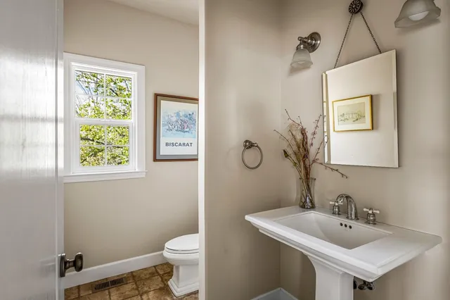 a view of work space with furniture and window
