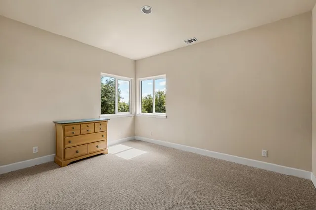 a bathroom with a sink mirror and window