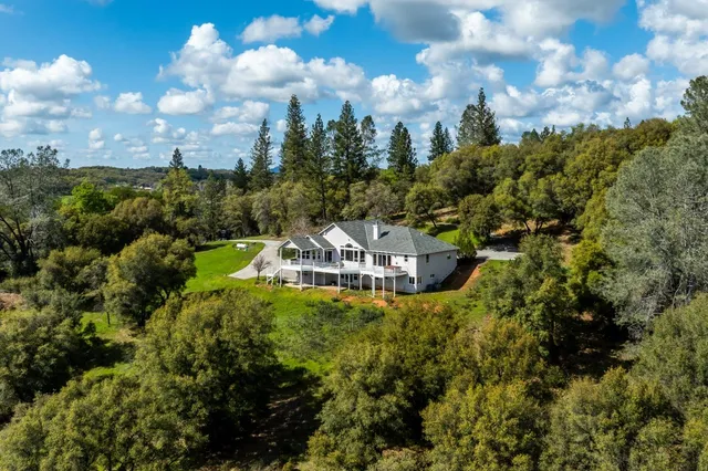 an aerial view of a house with a garden