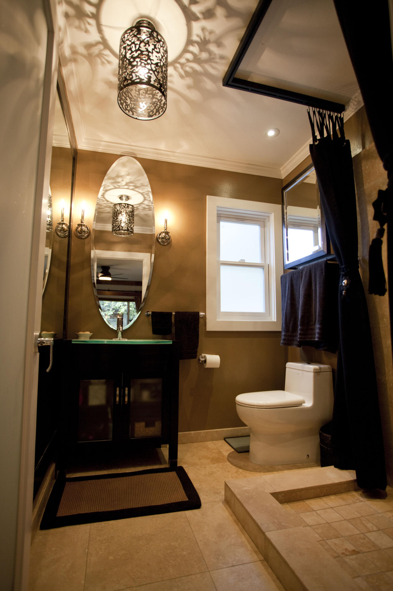 907 Cheltenham Road Santa Barbara, CA 93105 - Photo 11 of 31 a bathroom with a toilet sink and mirror