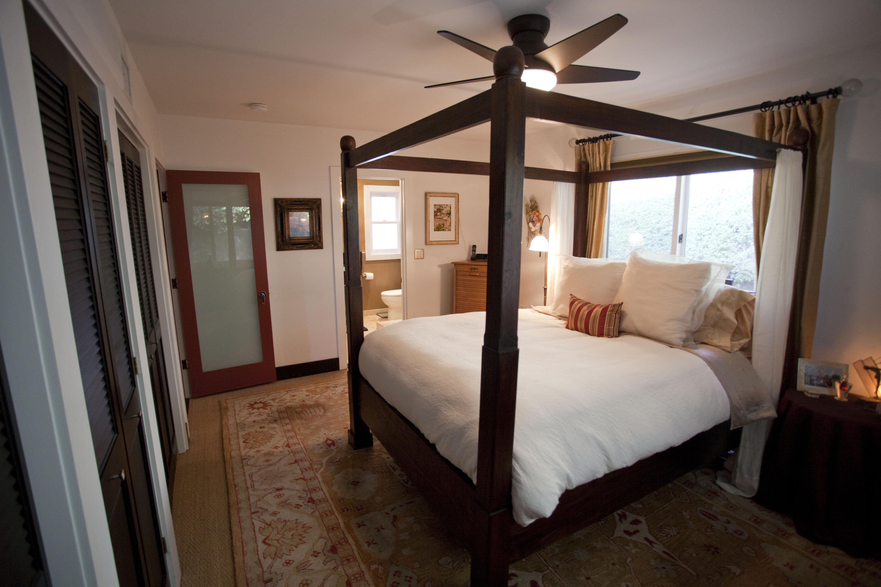 907 Cheltenham Road Santa Barbara, CA 93105 - Photo 10 of 31 a bedroom with a bed and a large mirror