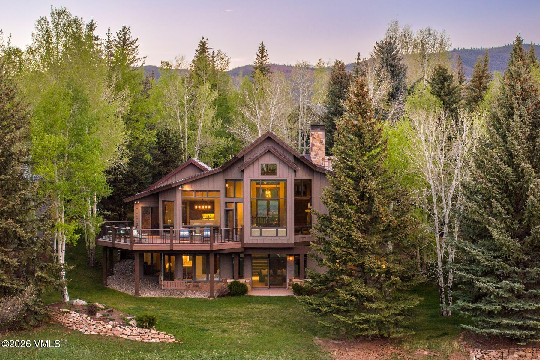 167 Saddle Ridge Edwards, CO 81632 - Photo 36 of 41 a view of a big house with a big yard and large trees