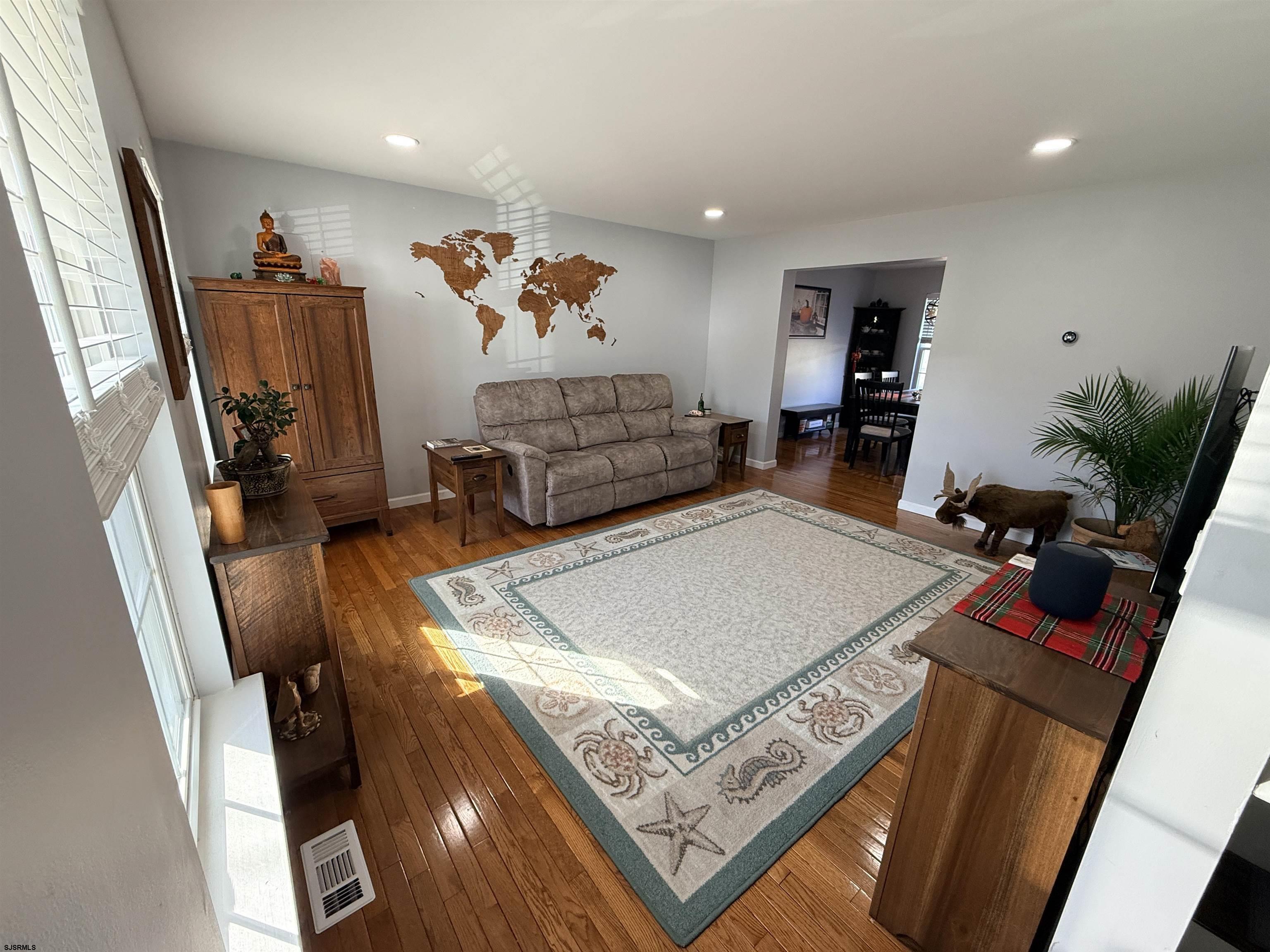 477 Damson Avenue Galloway Township, NJ 08205 - Photo 3 of 24 a room with furniture and a flat screen tv