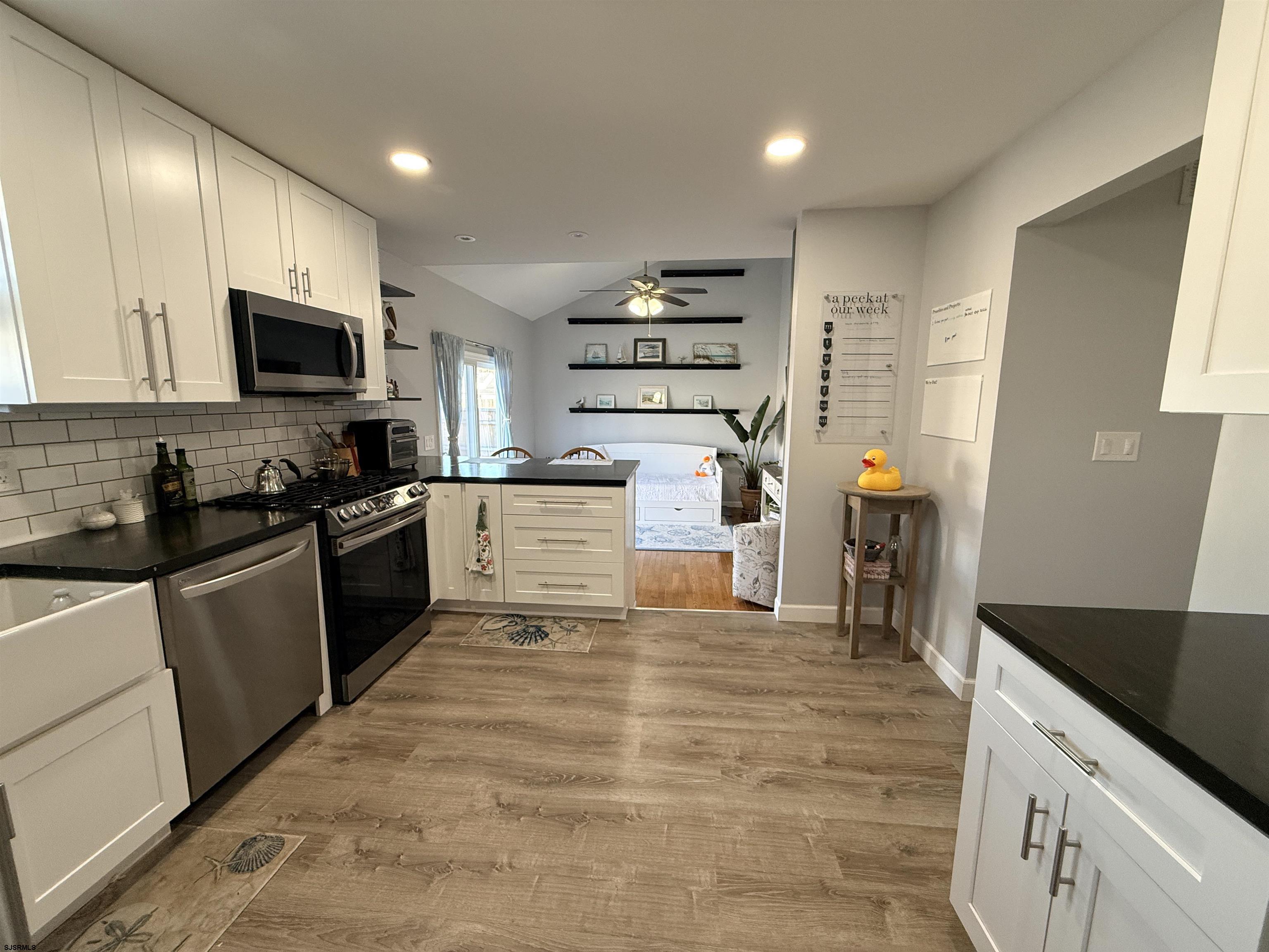 477 Damson Avenue Galloway Township, NJ 08205 - Photo 6 of 24 a kitchen with stainless steel appliances granite countertop a stove a sink and a refrigerator