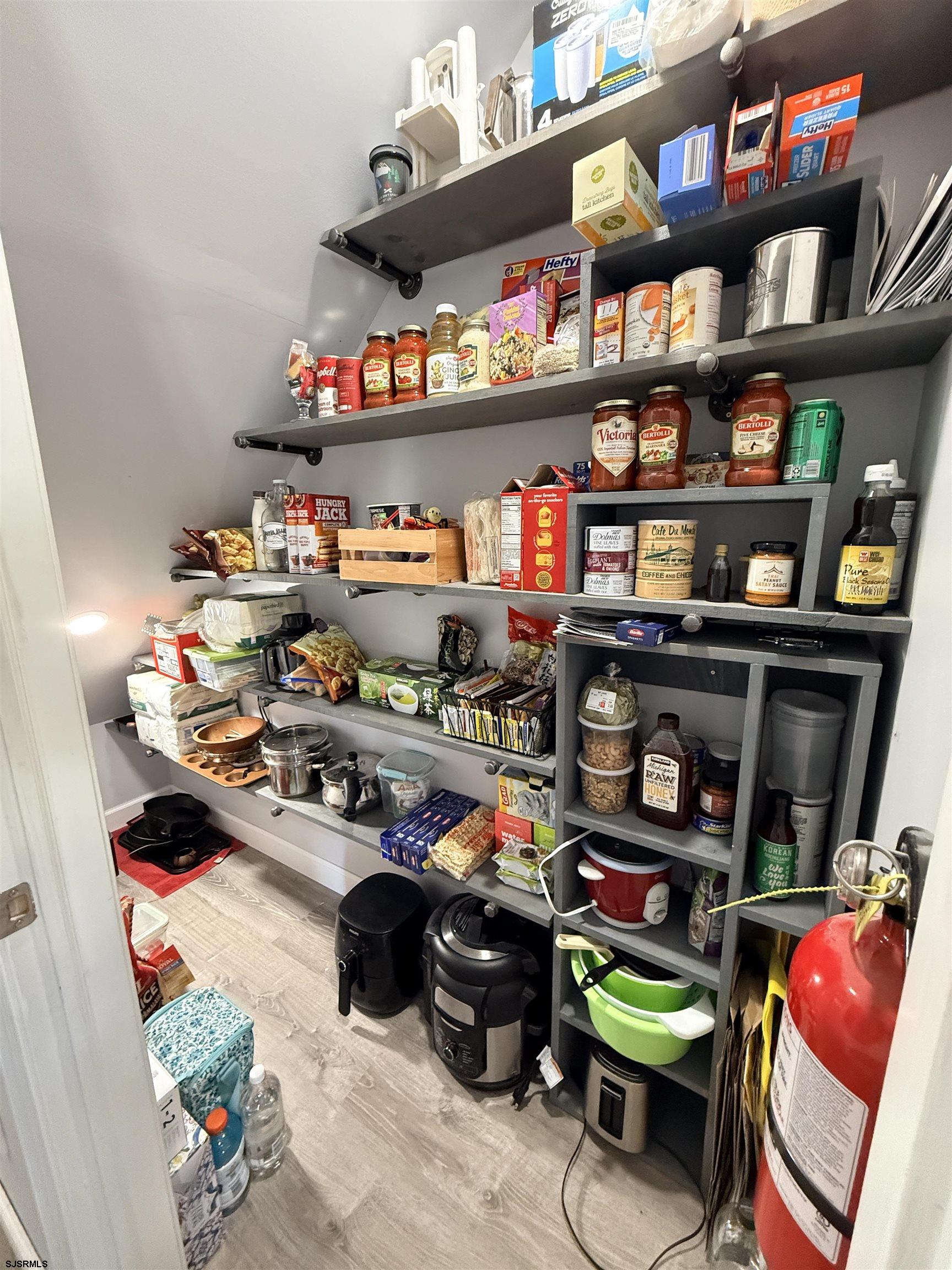 477 Damson Avenue Galloway Township, NJ 08205 - Photo 8 of 24 a room with lots of furniture and clutter