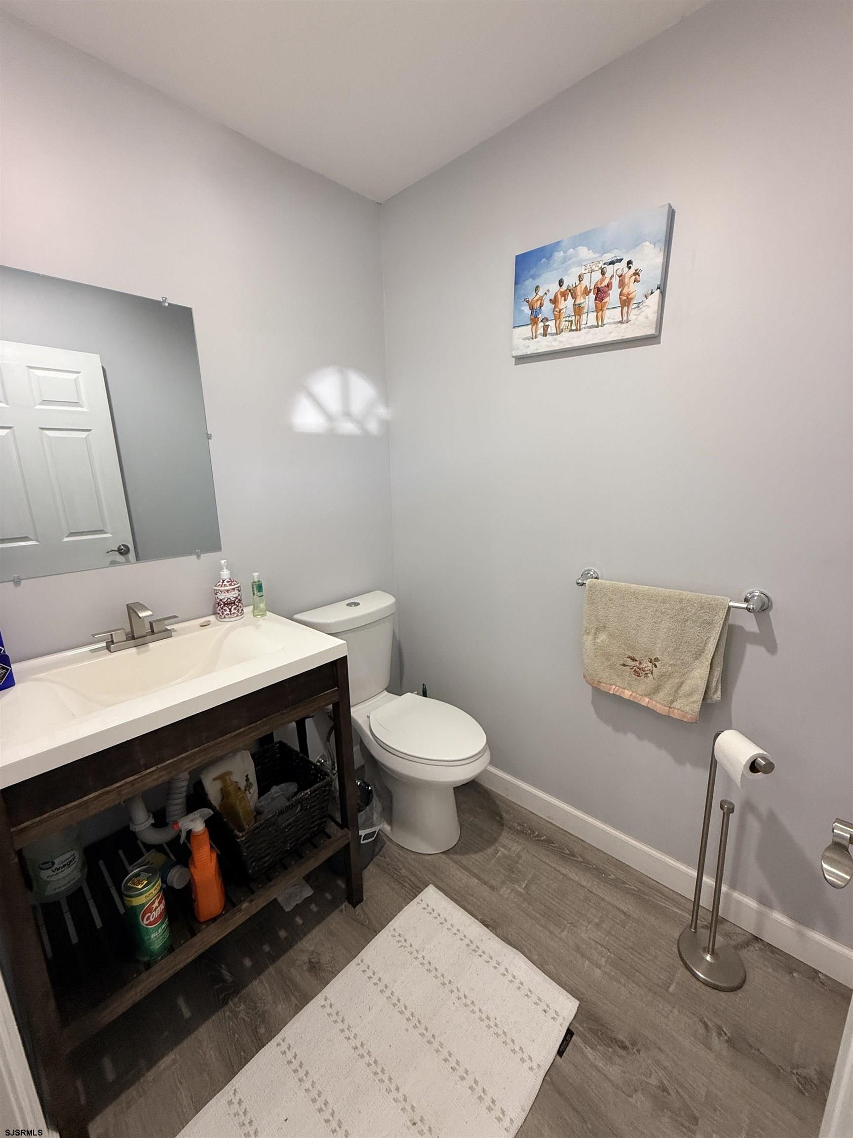 477 Damson Avenue Galloway Township, NJ 08205 - Photo 10 of 24 a bathroom with a sink a toilet and a mirror