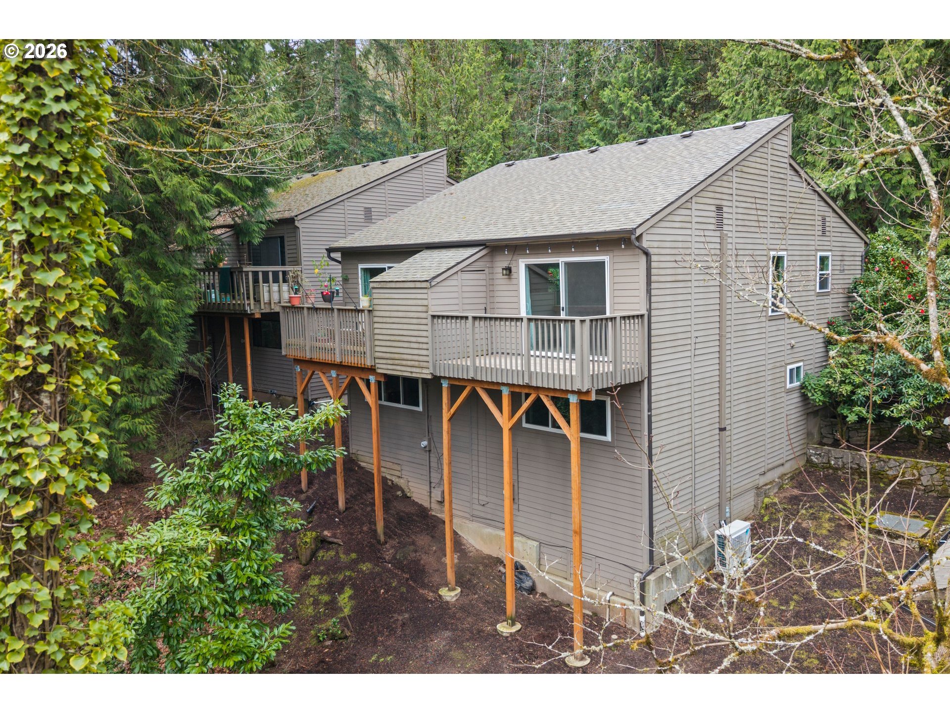 a aerial view of a house yard and balcony