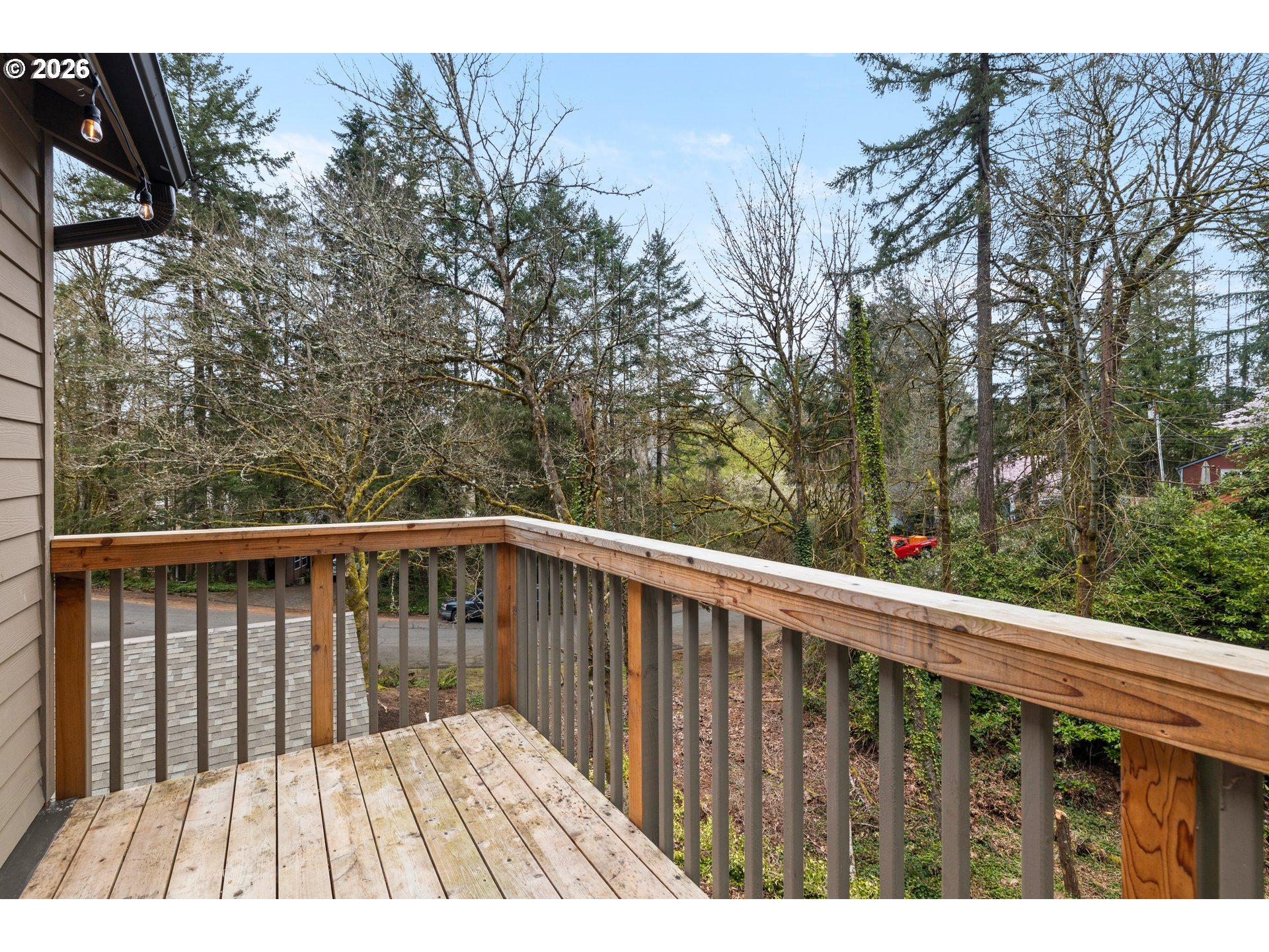 4594 Southwest Caldew Street, Unit A Portland, OR 97219 - Photo 15 of 29 a view of balcony with wooden floor and fence