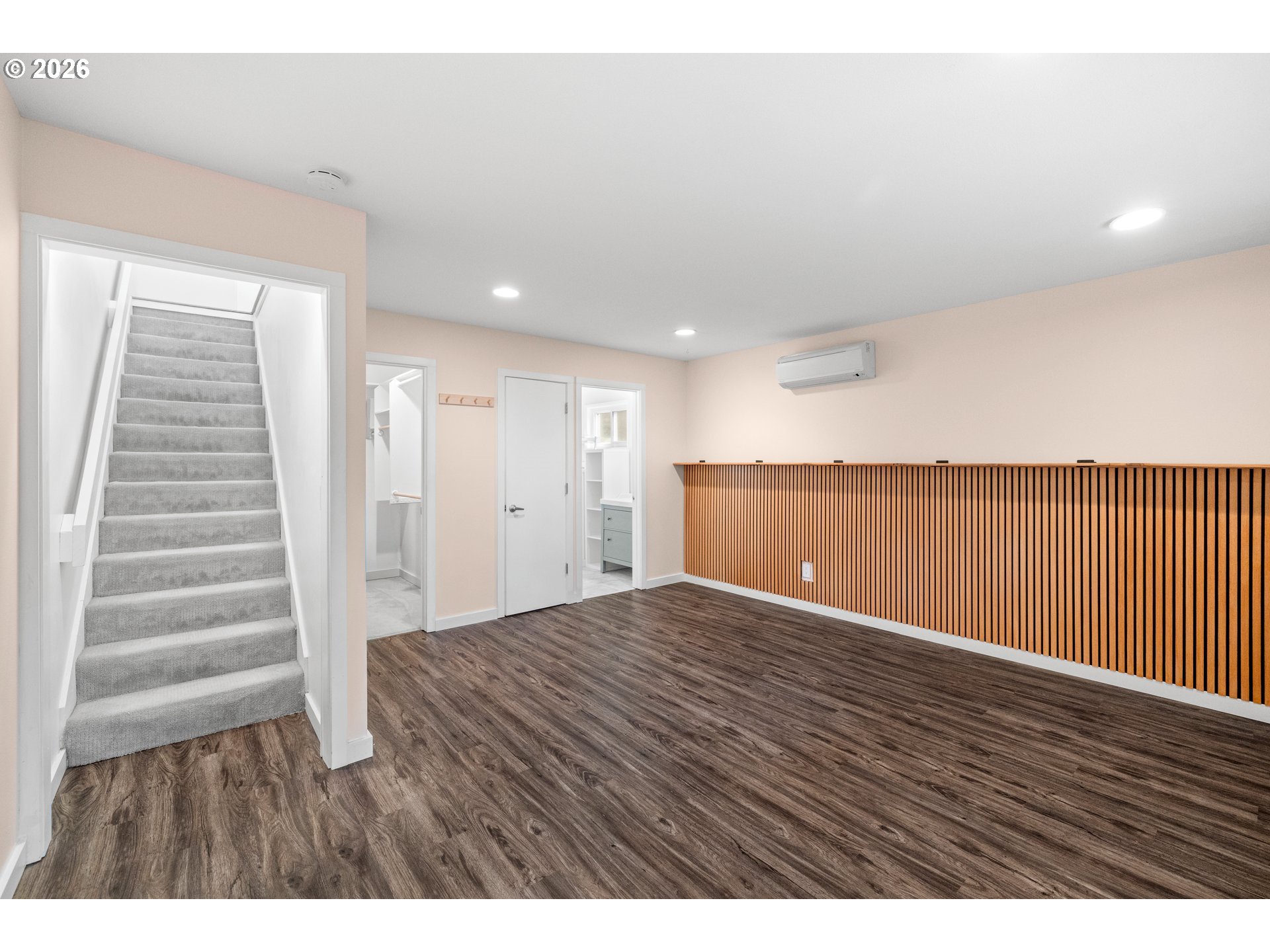 4594 Southwest Caldew Street, Unit A Portland, OR 97219 - Photo 16 of 29 a view of an empty room with wooden floor