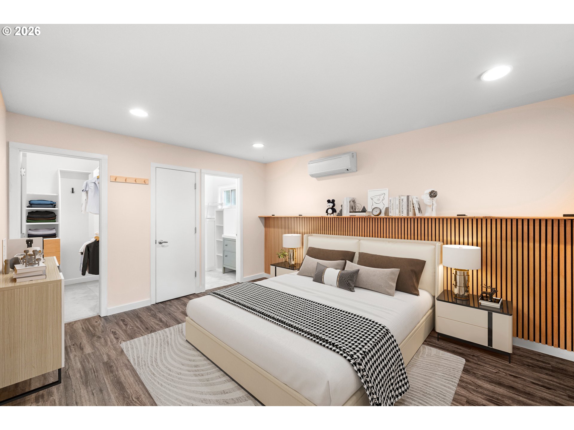 4594 Southwest Caldew Street, Unit A Portland, OR 97219 - Photo 17 of 29 a bedroom with a bed and wooden floor