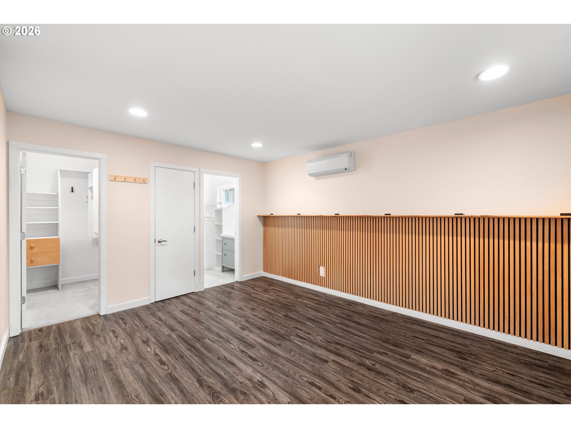 4594 Southwest Caldew Street, Unit A Portland, OR 97219 - Photo 18 of 29 a view of an empty room with wooden floor