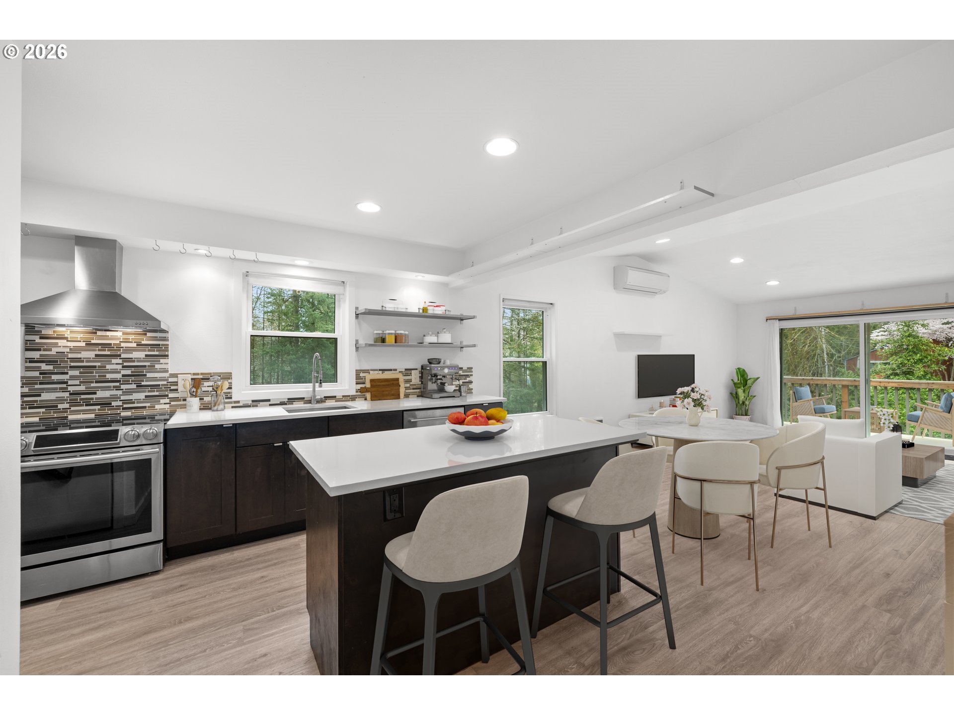 4594 Southwest Caldew Street, Unit A Portland, OR 97219 - Photo 3 of 29 a kitchen with a table and chairs