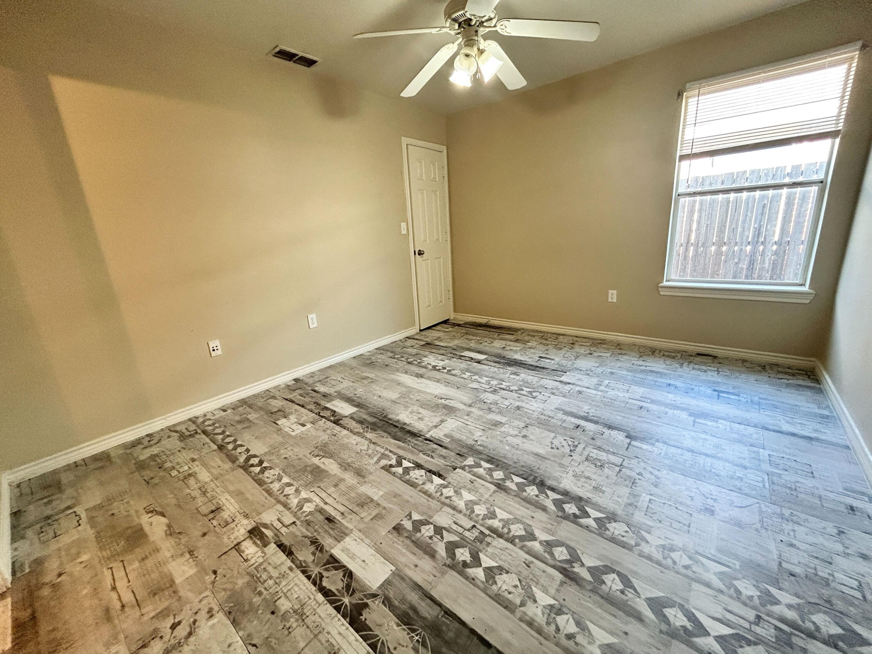 5413 Harvard Street, Unit B Lubbock, TX 79416 - Photo 5 of 10 a view of an empty room and window