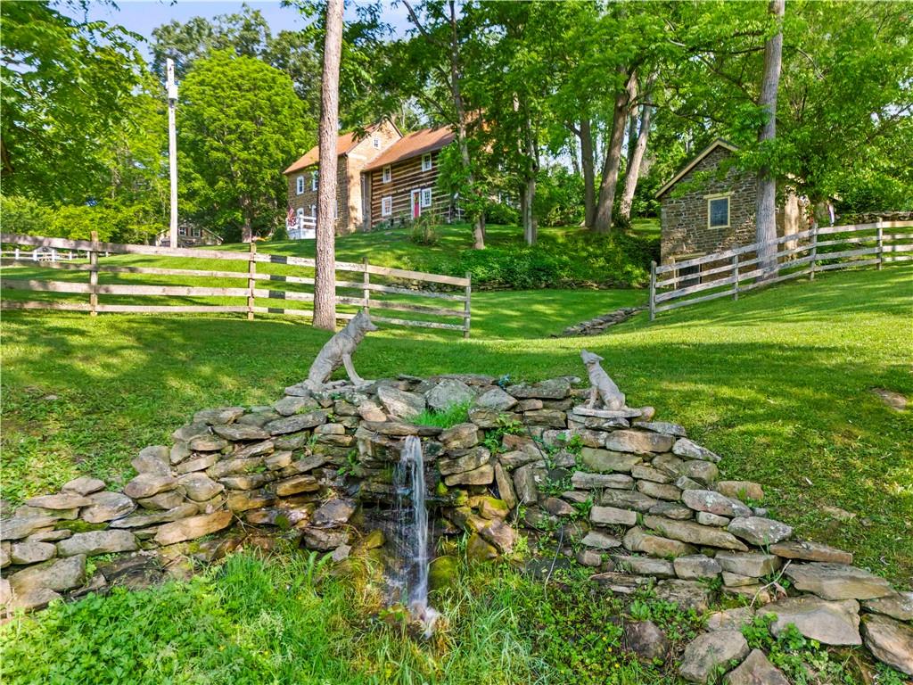 117 Havers Hill Road Jefferson, PA 15344 - Photo 11 of 44 a garden with trees in front of it