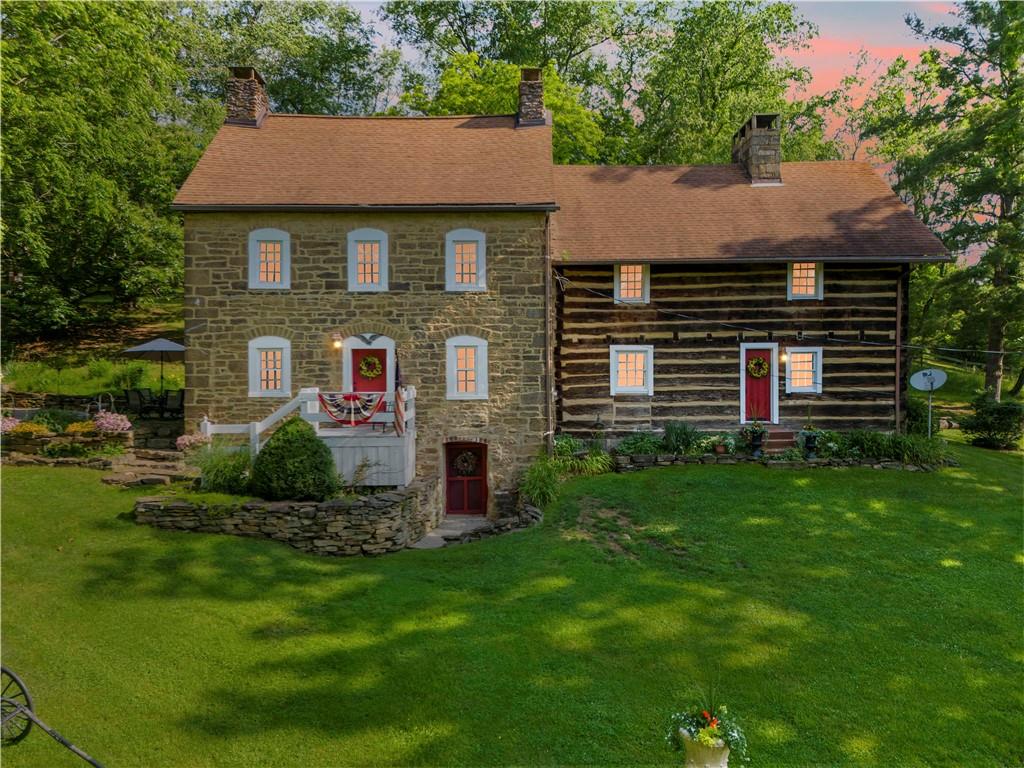 117 Havers Hill Road Jefferson, PA 15344 - Photo 3 of 44 a front view of a house with a garden