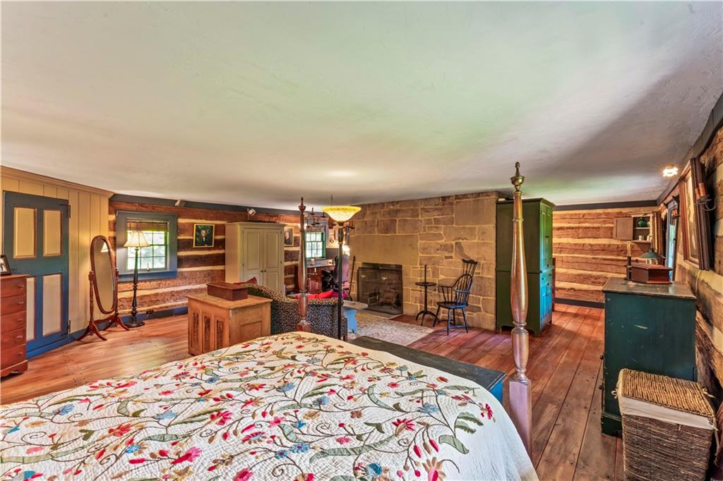 117 Havers Hill Road Jefferson, PA 15344 - Photo 31 of 44 a living room with furniture a rug and a flat screen tv