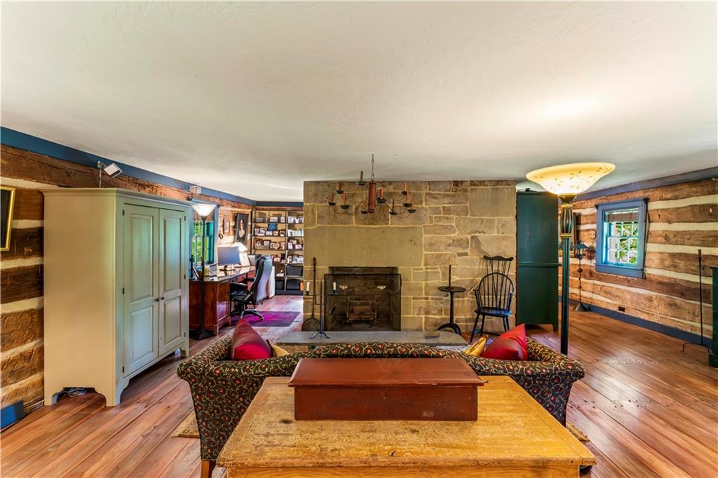 117 Havers Hill Road Jefferson, PA 15344 - Photo 33 of 44 a living room with furniture rug and a fireplace