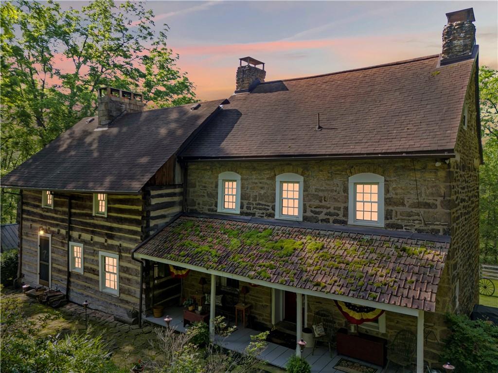 117 Havers Hill Road Jefferson, PA 15344 - Photo 7 of 44 a front view of a house with table and chairs