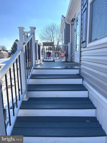 a kitchen with kitchen island granite countertop a sink counter top space and stainless steel appliances