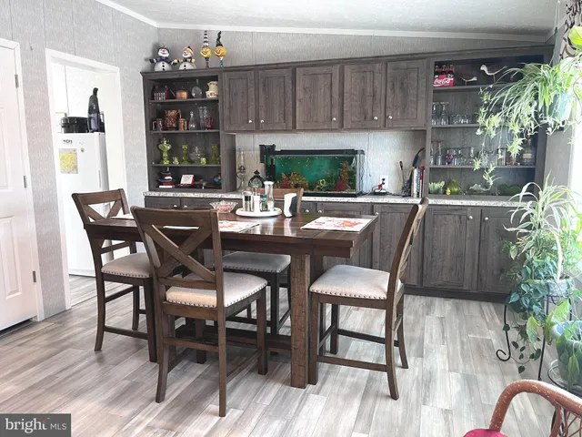 a kitchen with lots of bottles of alcohol