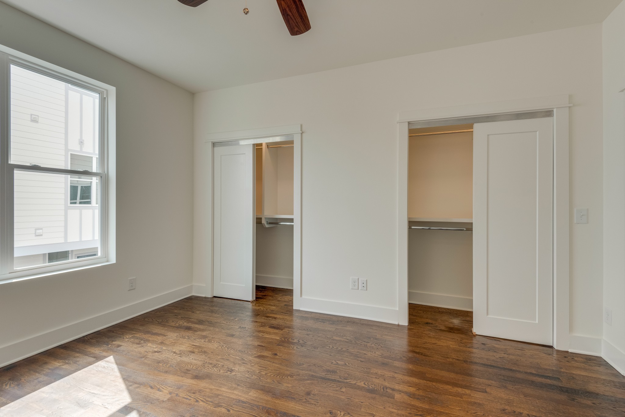 2001 Convent Place, Unit 16 Nashville, TN 37212 - Photo 11 of 24 an empty room with wooden floor cabinet and windows