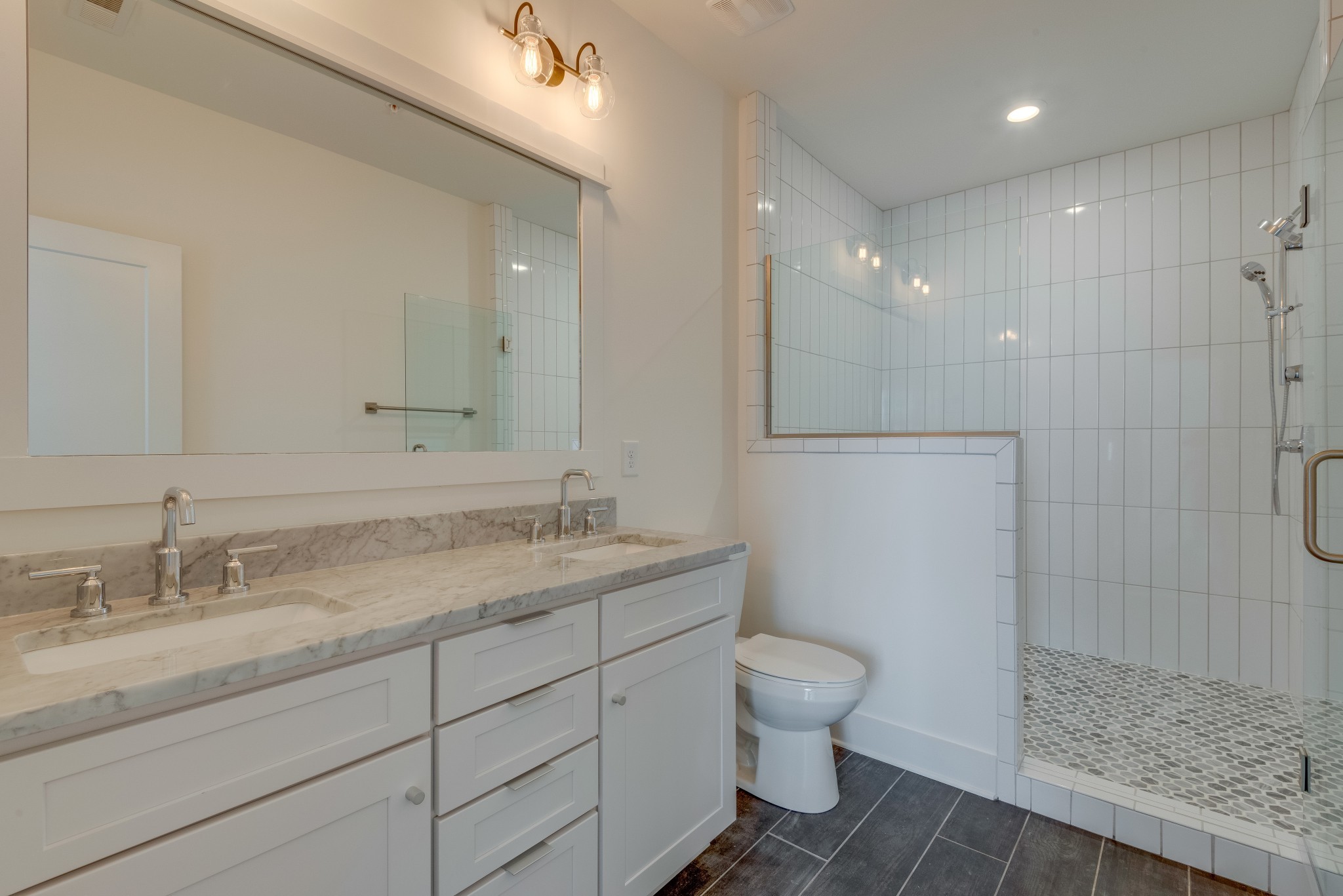 2001 Convent Place, Unit 16 Nashville, TN 37212 - Photo 12 of 24 a bathroom with a granite countertop sink a toilet and a shower