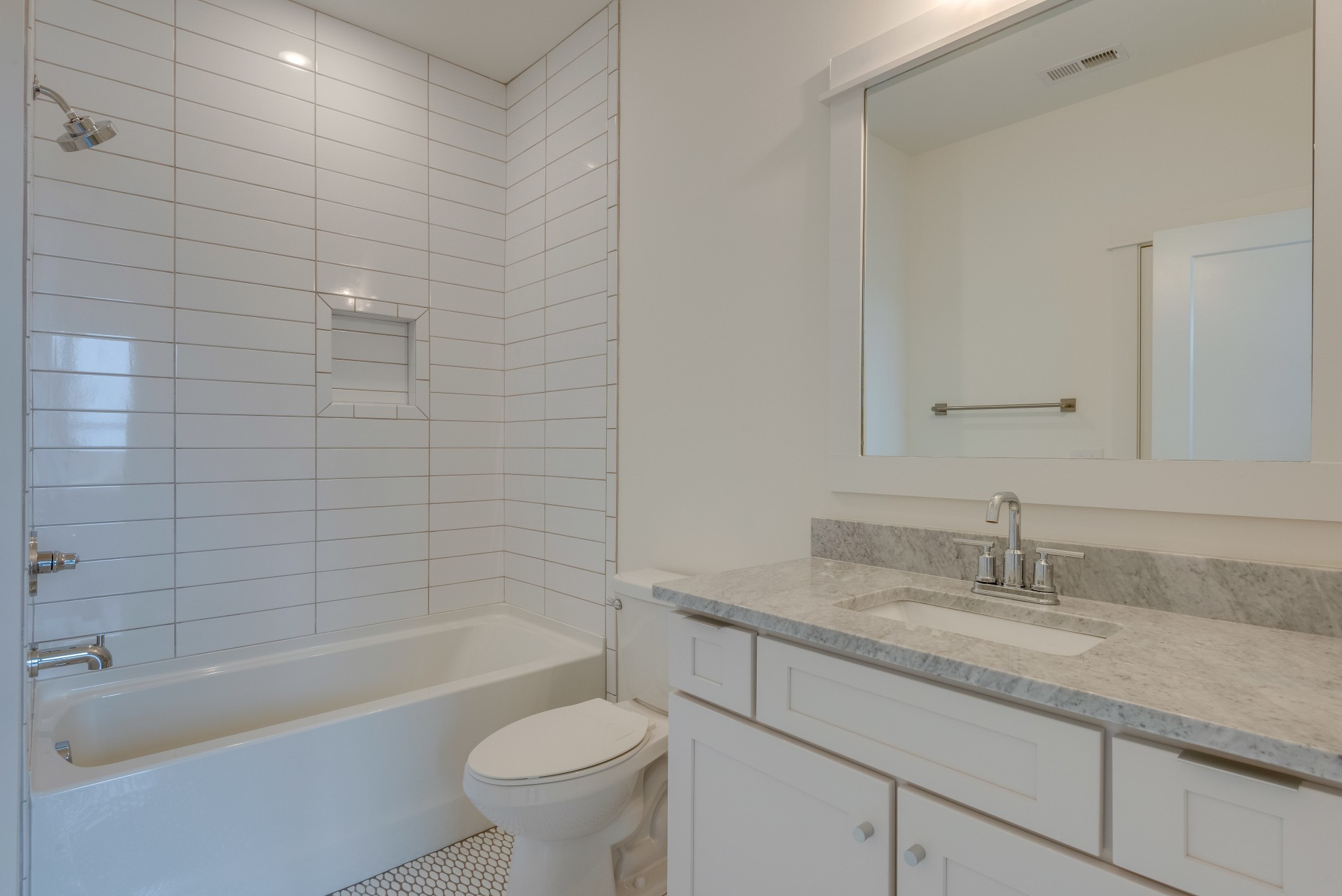 2001 Convent Place, Unit 16 Nashville, TN 37212 - Photo 15 of 24 a bathroom with a granite countertop sink a toilet and bathtub