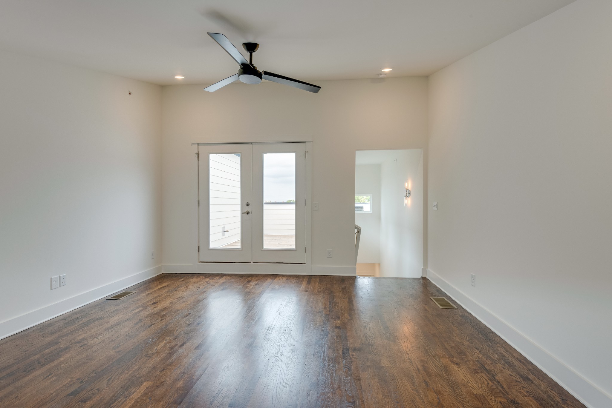 2001 Convent Place, Unit 16 Nashville, TN 37212 - Photo 17 of 24 a view of an empty room with wooden floor and a window