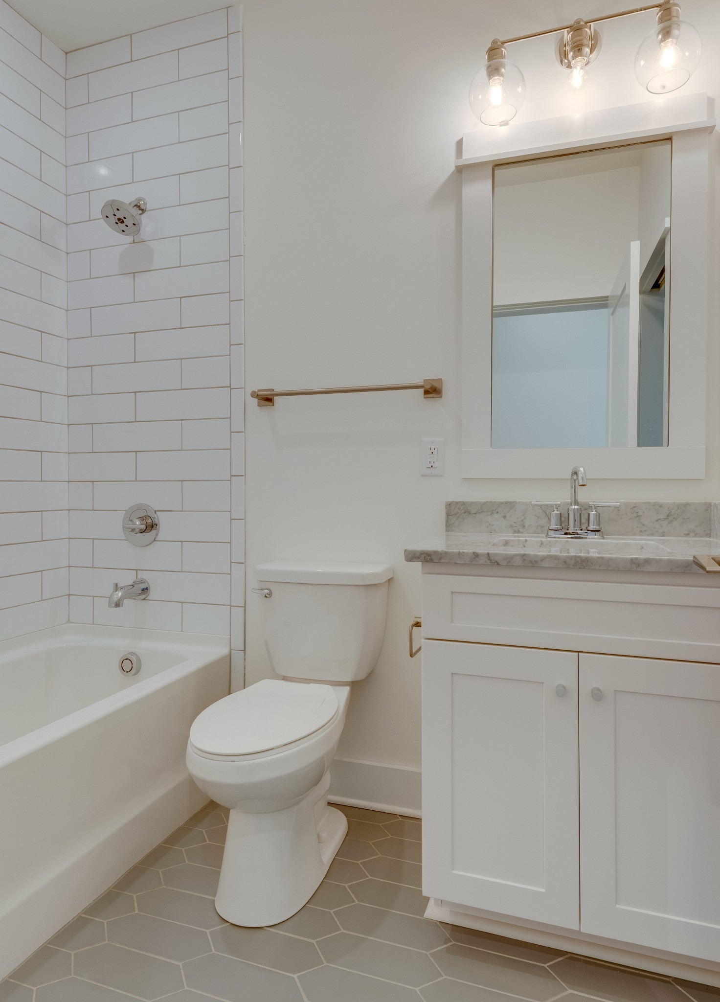 2001 Convent Place, Unit 16 Nashville, TN 37212 - Photo 3 of 24 a bathroom with a granite countertop toilet a sink and bathtub