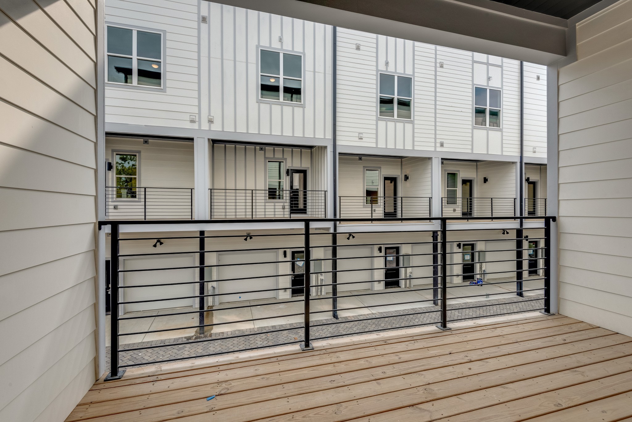 2001 Convent Place, Unit 16 Nashville, TN 37212 - Photo 5 of 24 a view of a balcony with wooden door and stairs